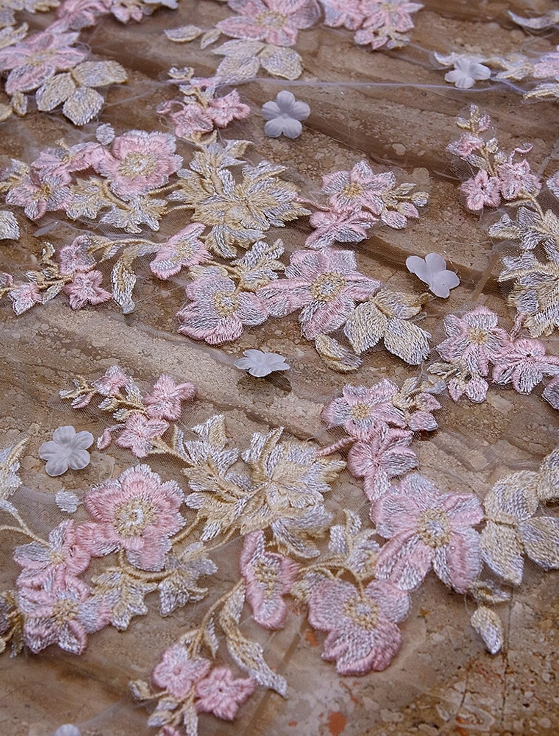 Detailed view of the tulle fabric and lace trim on the bridal veil.