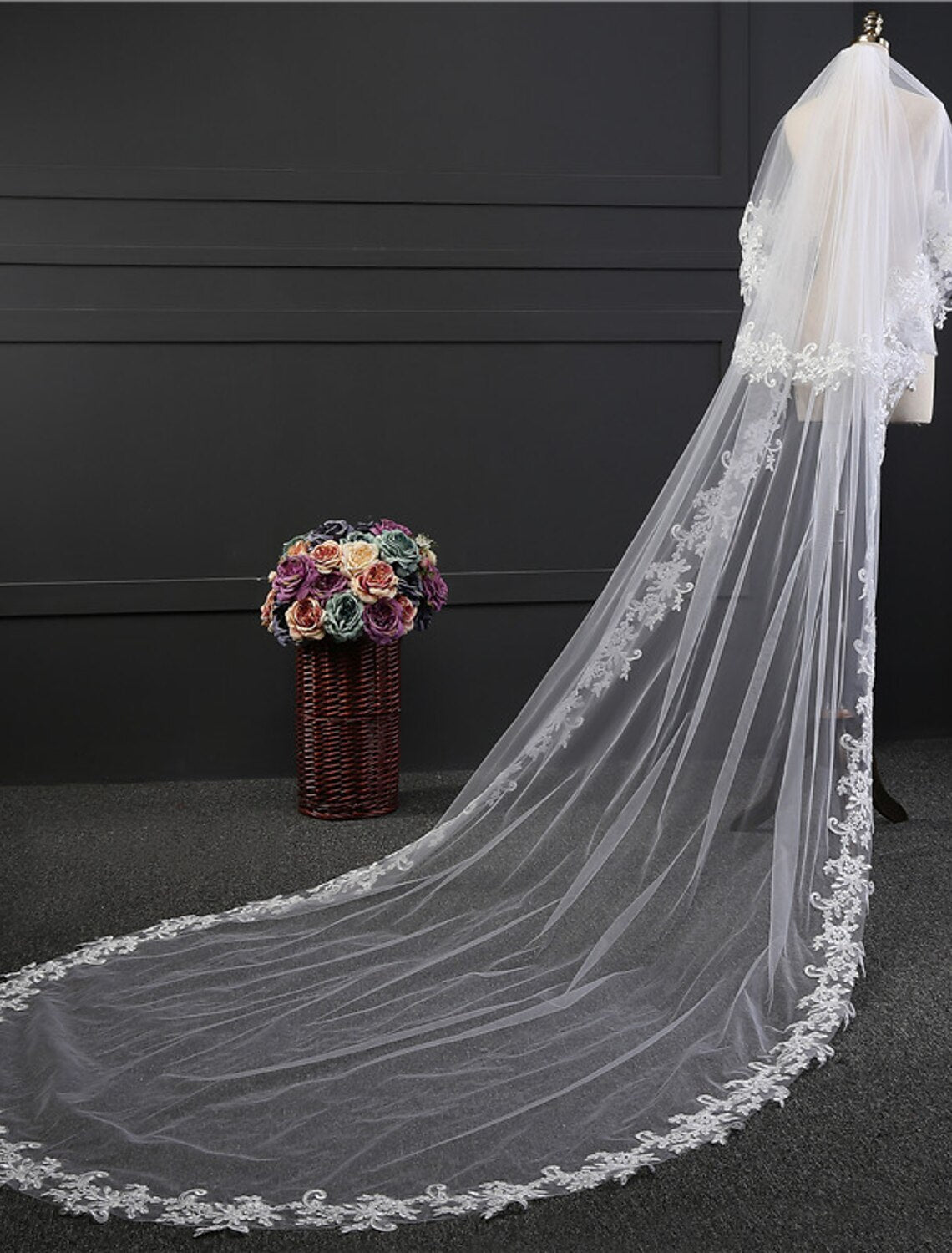 Close-up of intricate lace appliques on a wedding veil.