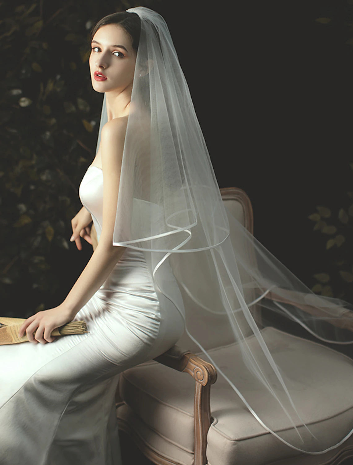 Front view of a bride showcasing a classic two-tier chapel veil.