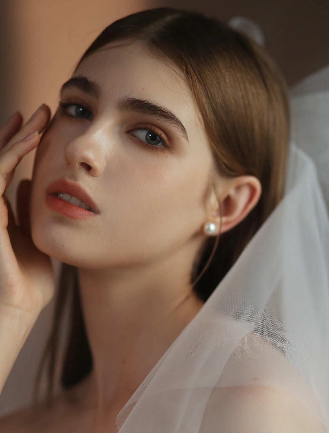 Close-up of the delicate pure color tulle fabric of the two-tier wedding veil.