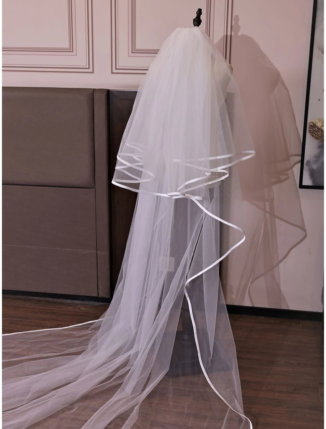 Back view of a two-tier wedding veil, highlighting its flowing cathedral length.