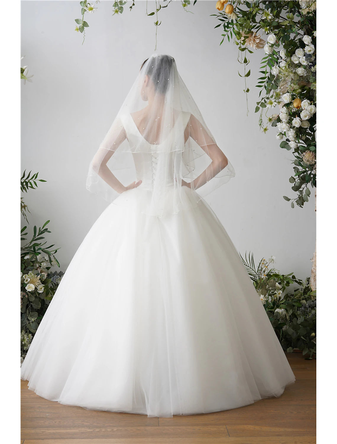 Bridal veil showcasing the delicate faux pearl embellishments.