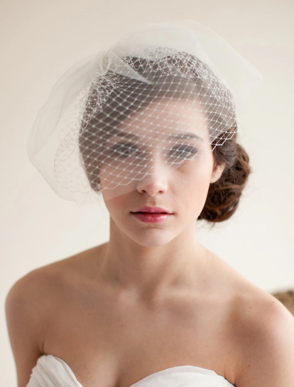Close-up of the two-tier white tulle blusher wedding veil.