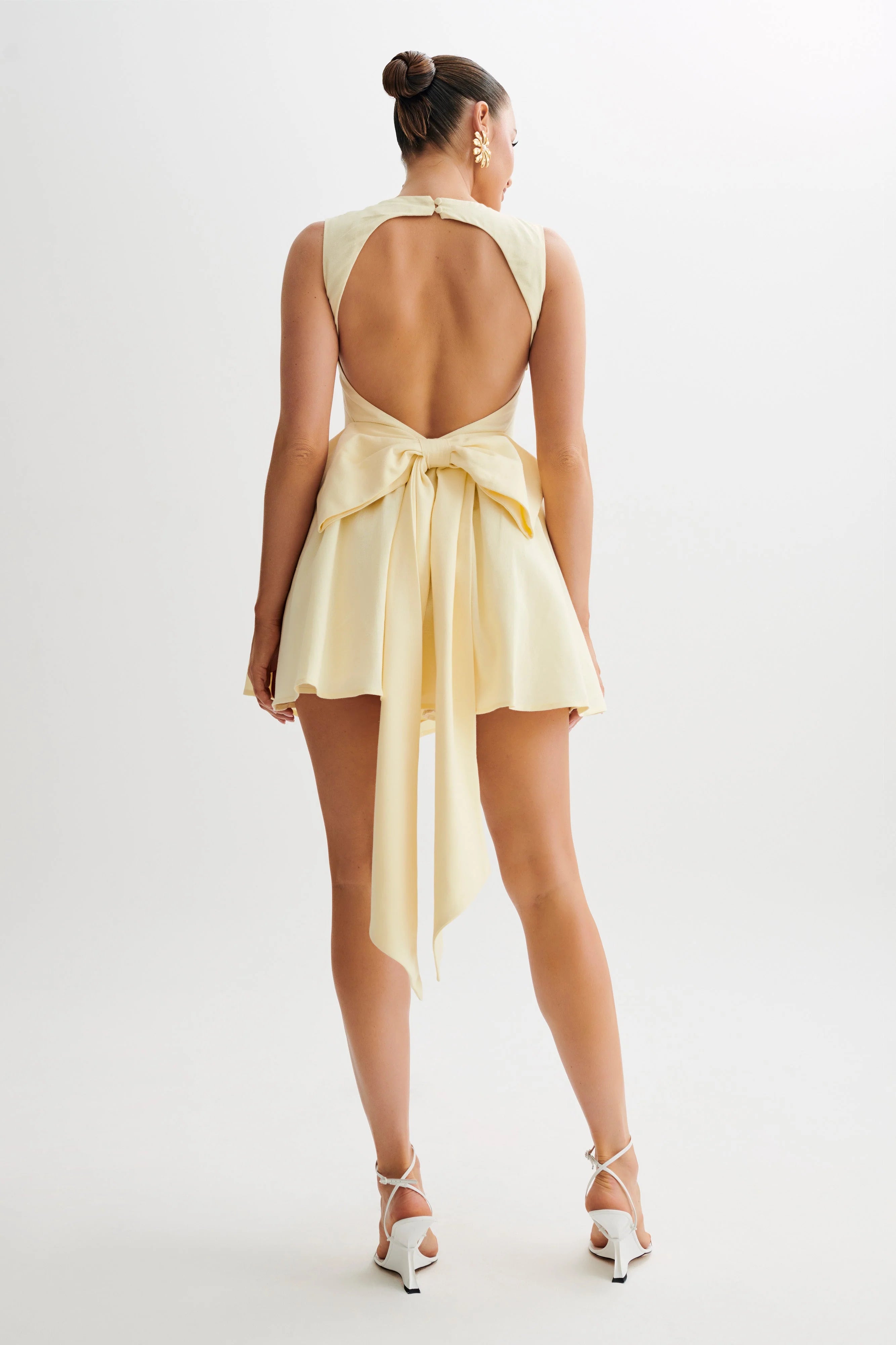 Back view of the mini homecoming dress showcasing the bow detail.