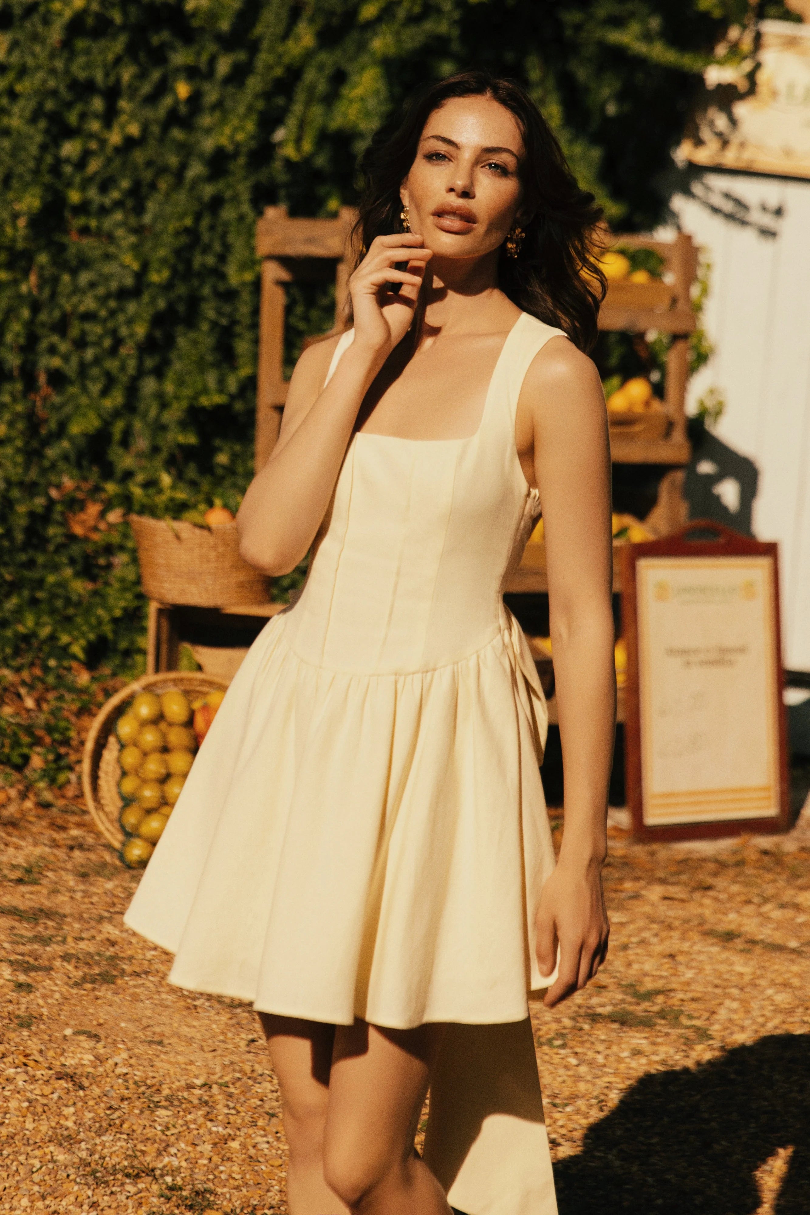 Side profile of the A-line mini dress with a backless design.