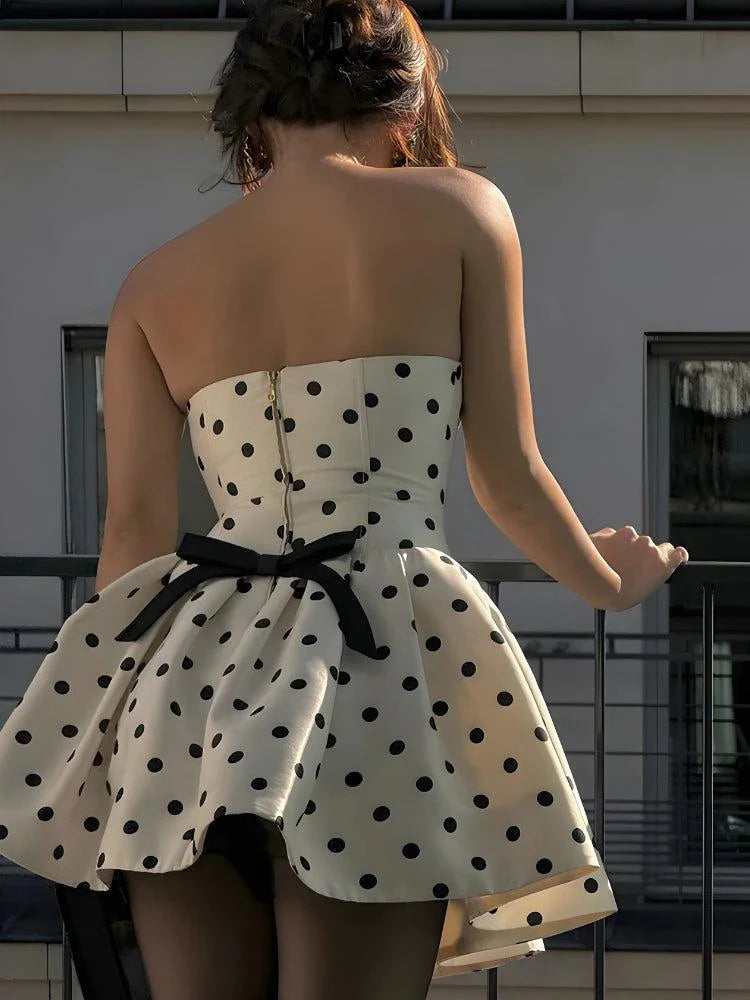 Side view of the preppy A-line polka dot dress, highlighting its silhouette.