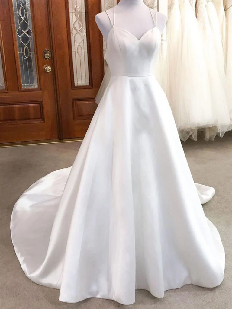 Woman wearing an elegant V-neck A-line satin wedding dress.