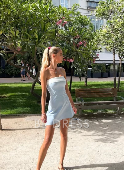 Woman posing in a V-neck A-line formal gown.