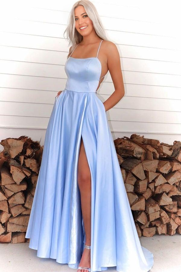 Royal blue A-line prom dress with spaghetti straps and high slit.