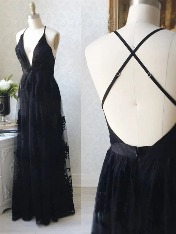 Woman wearing an elegant V-neck backless lace long prom dress.