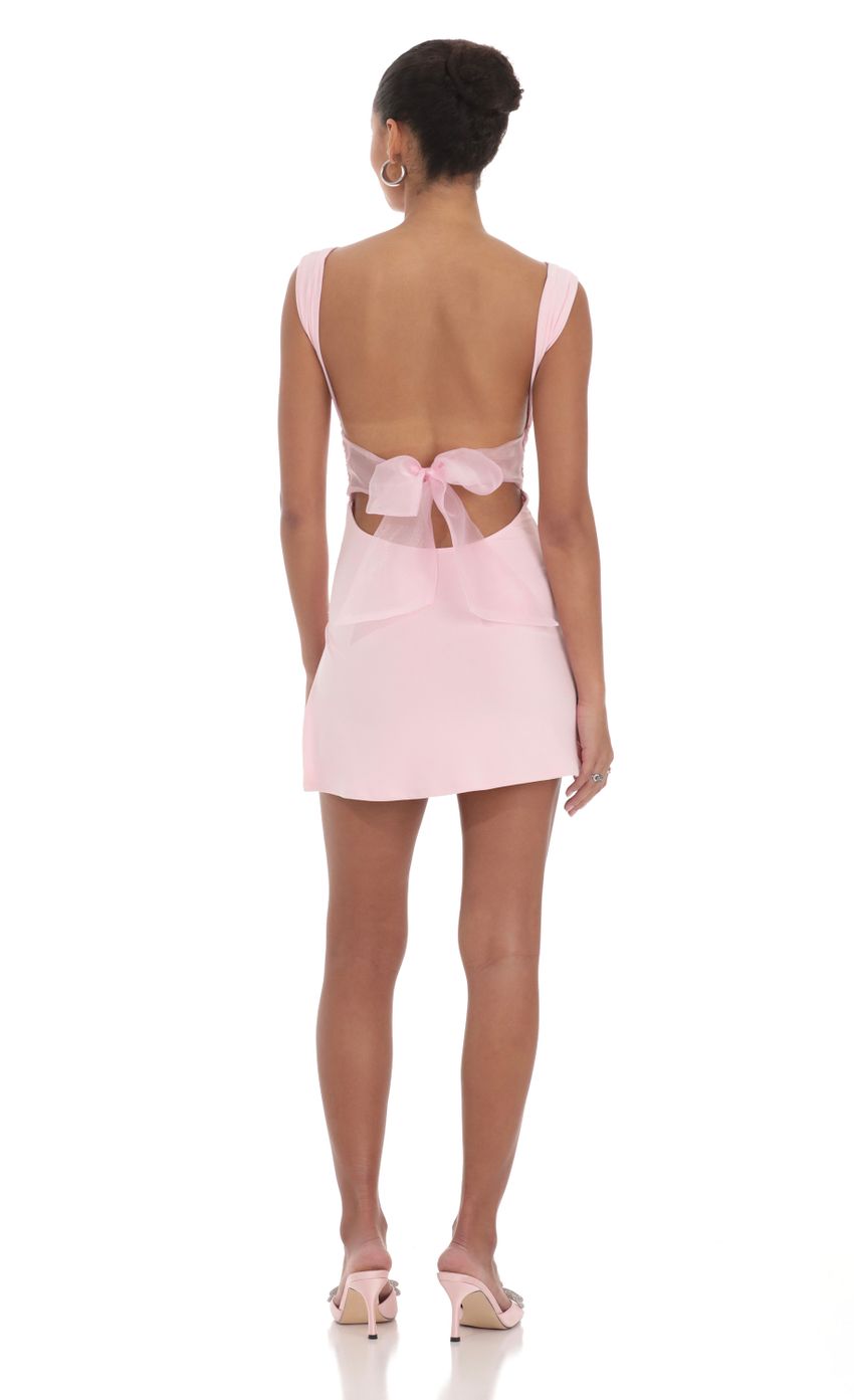 Back view of the bodycon dress showcasing the tulle and bow embellishment.