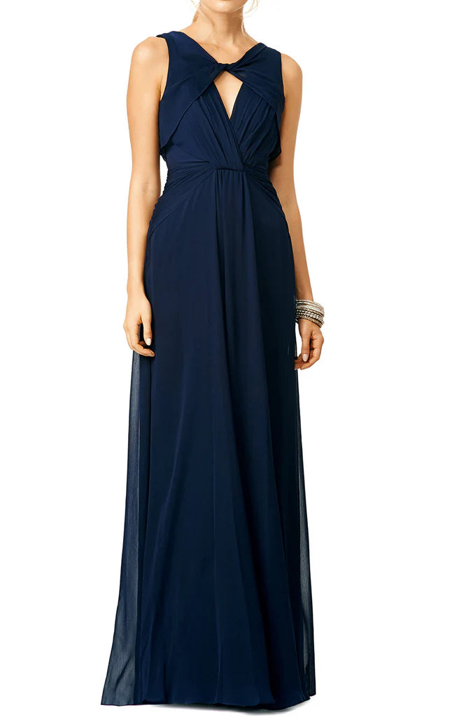 Elegant V-neck chiffon formal gown with spaghetti straps and open back.