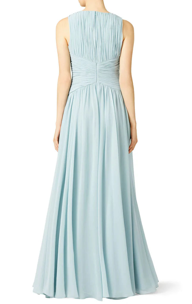 Flowy chiffon formal gown with V-neck and spaghetti straps.