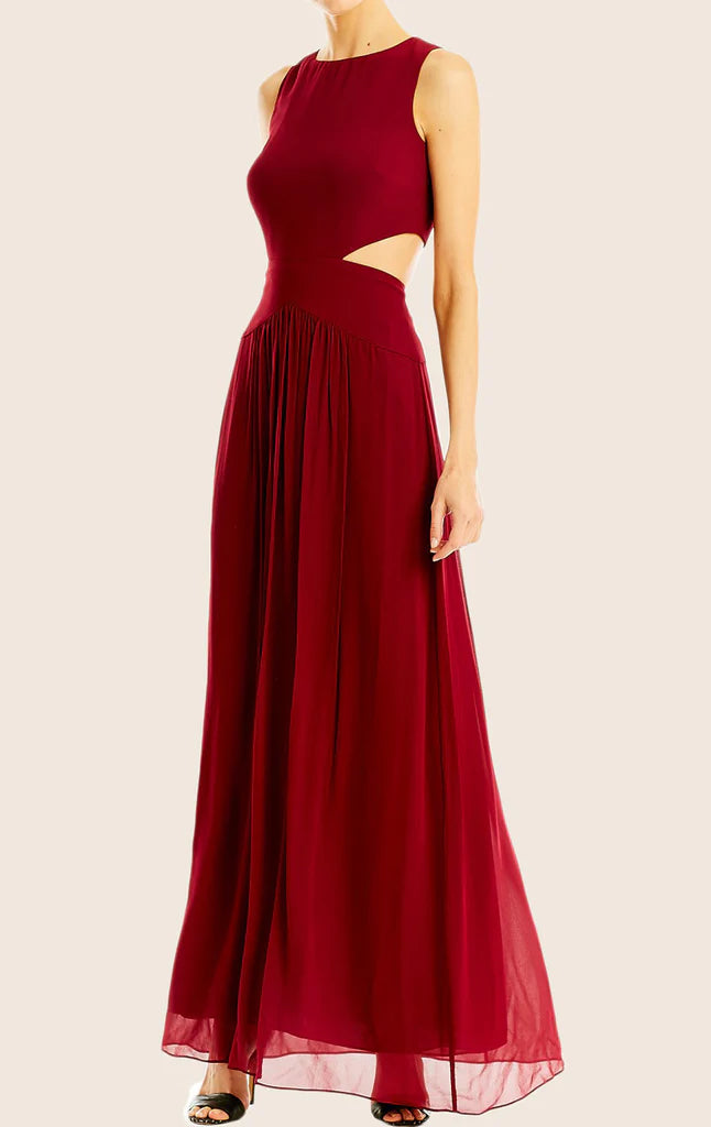 A woman wearing an elegant V-neck chiffon maxi gown.