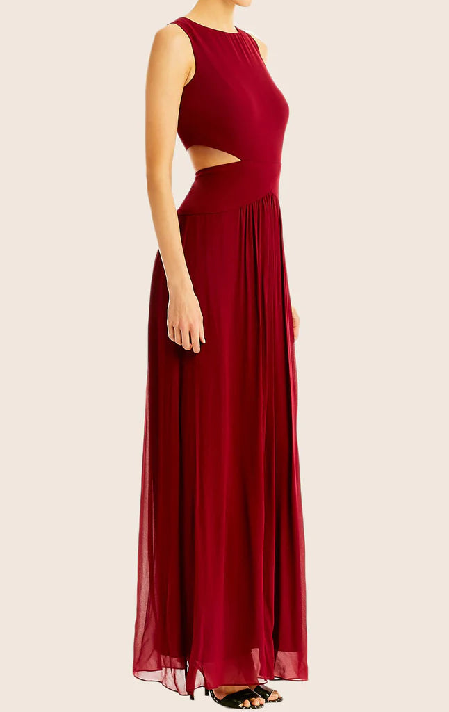 Back view of a woman in a V-neck chiffon gown, showcasing the maxi length.