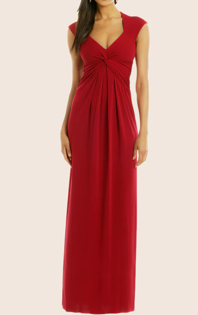 Woman wearing an elegant V-neck sleeveless formal evening gown.