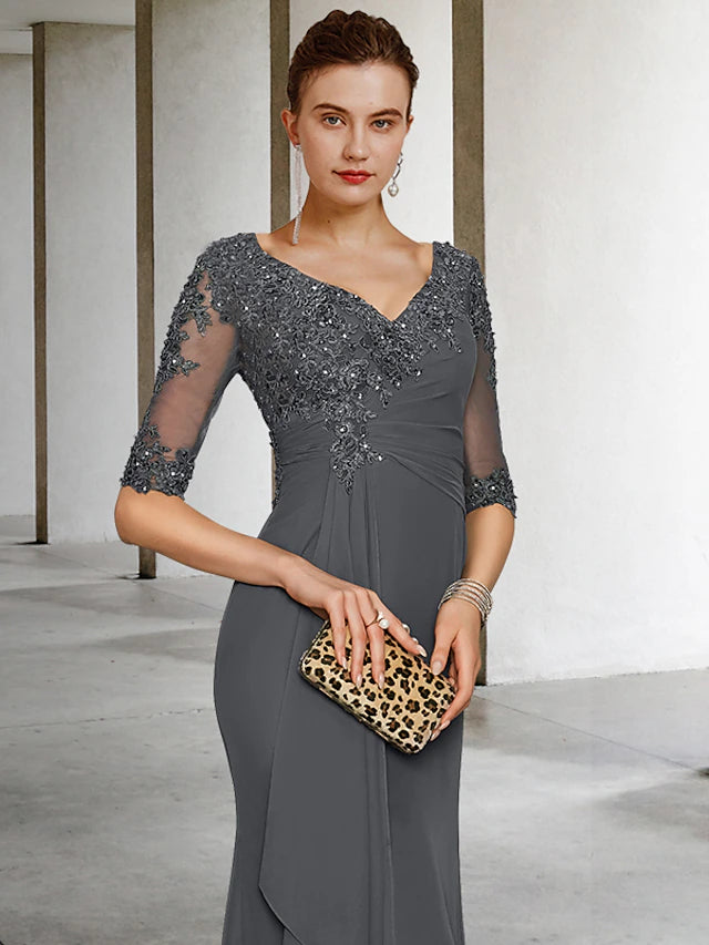 Side view of the mermaid trumpet gown showing side-draped detail and appliques.