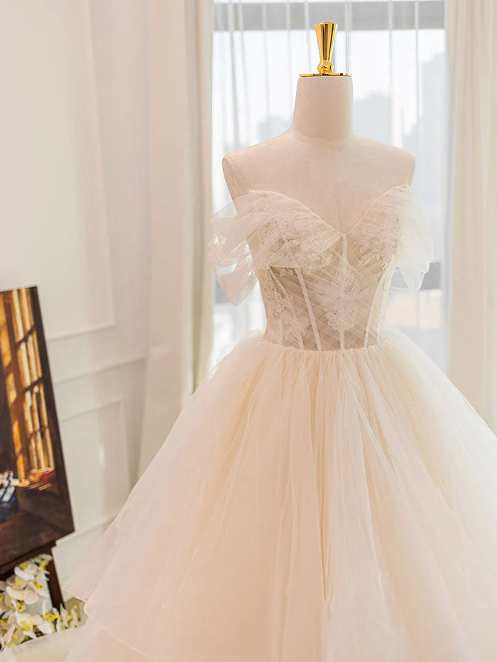 Close-up of lace and tulle details on a bridal gown.