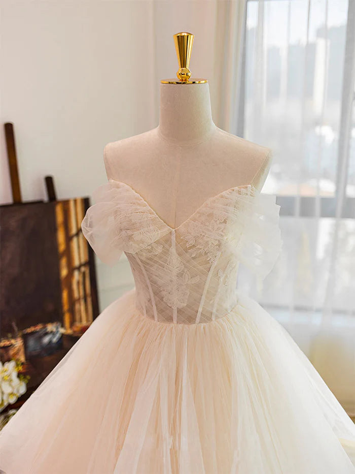 Bride wearing a flowing white tulle wedding dress.
