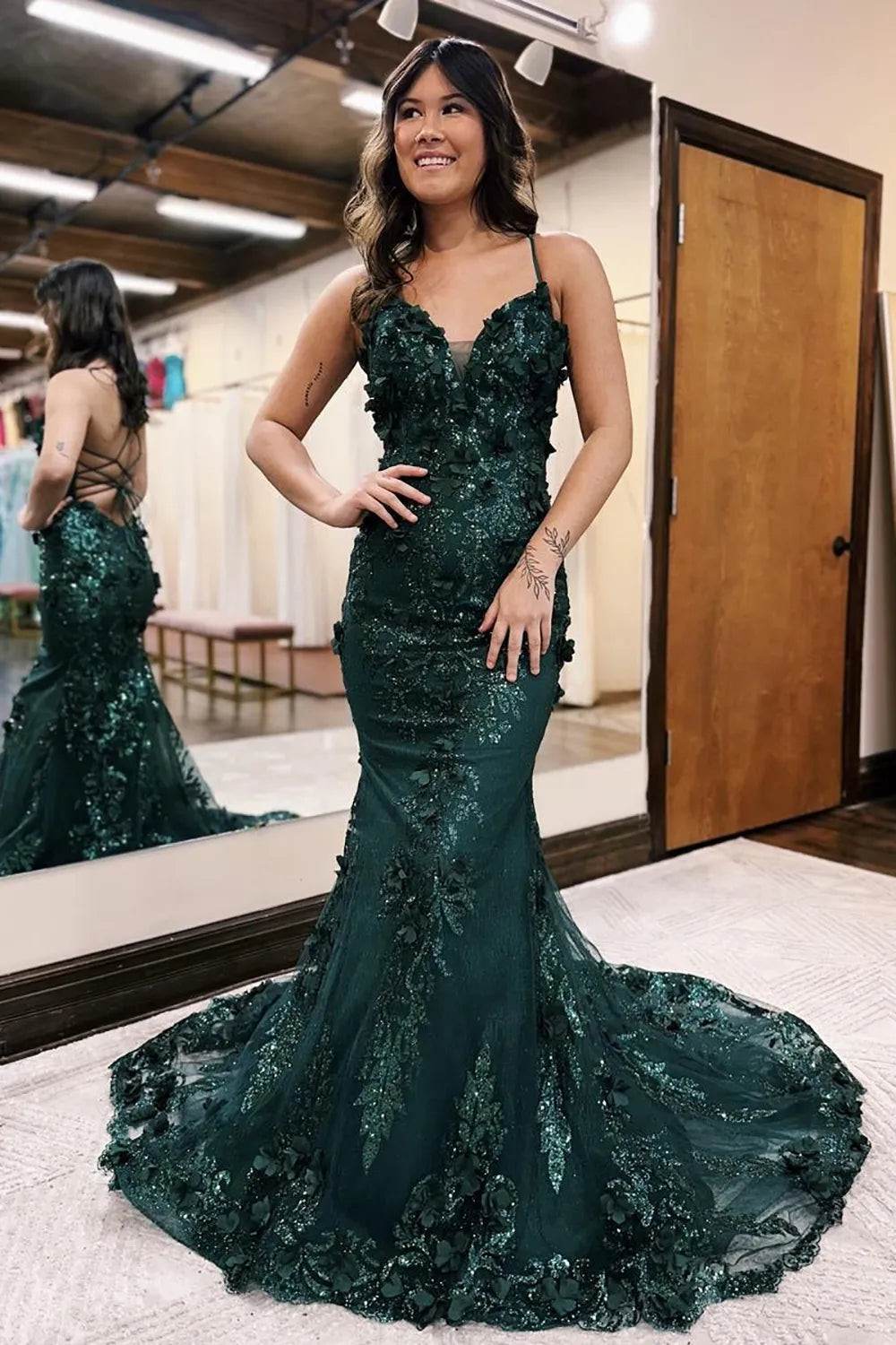 Elegant V-neck prom gown with spaghetti straps and lace-up back.