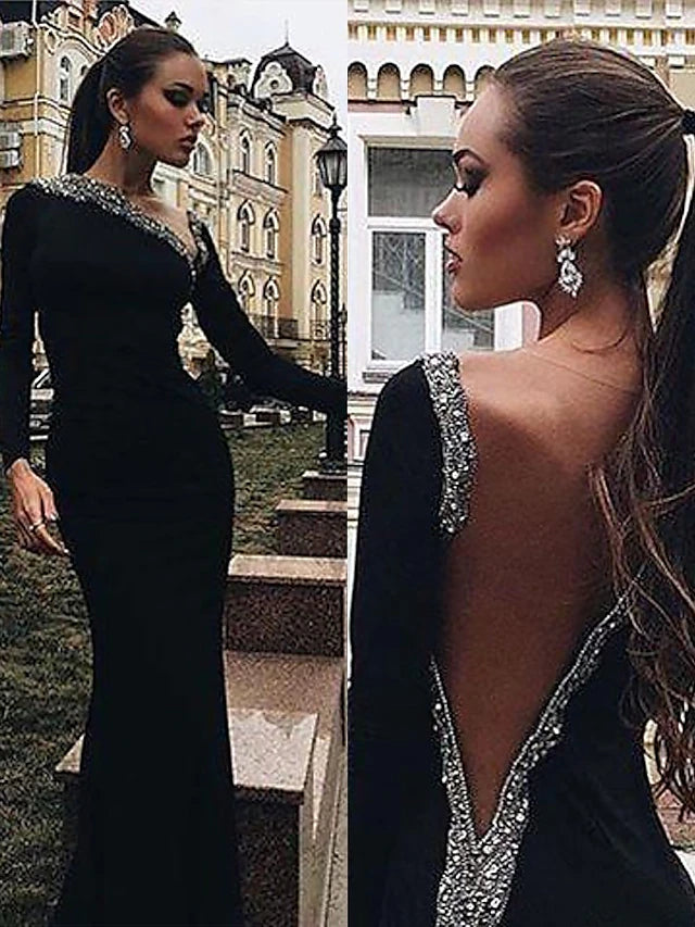 Mermaid trumpet evening gown showcasing open back and floor length.