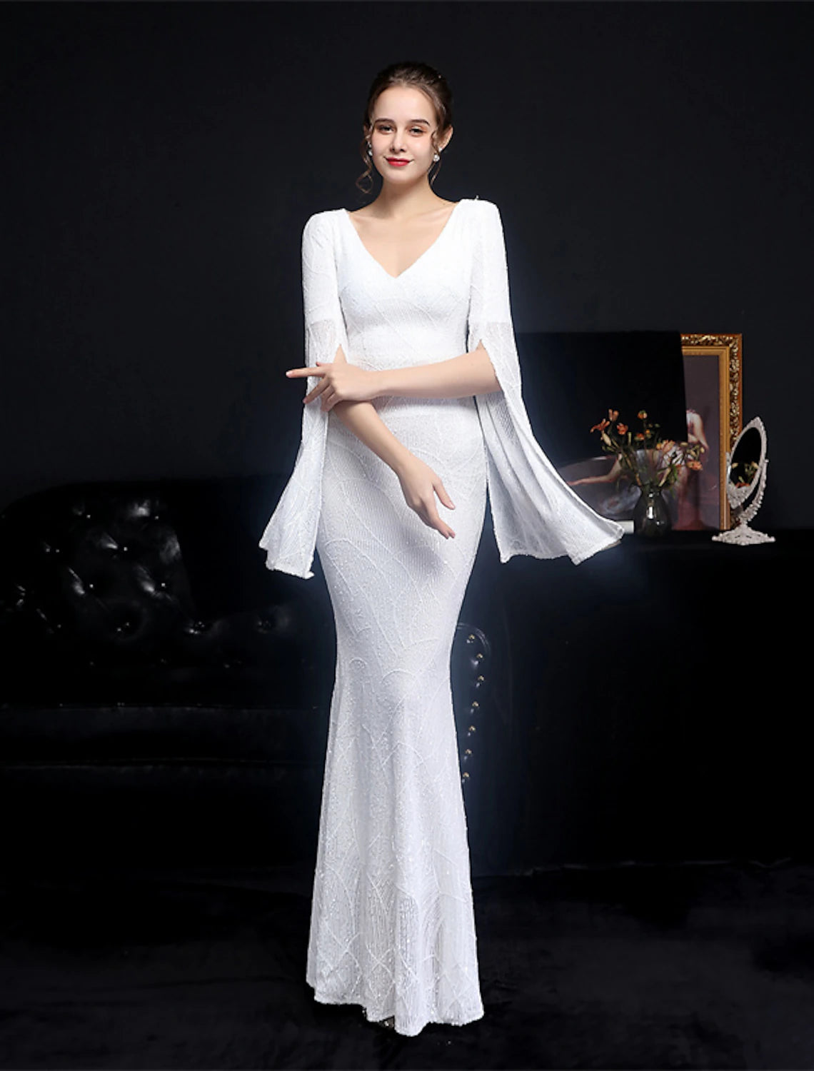 Glamorous long sleeve V-neck mermaid trumpet gown.