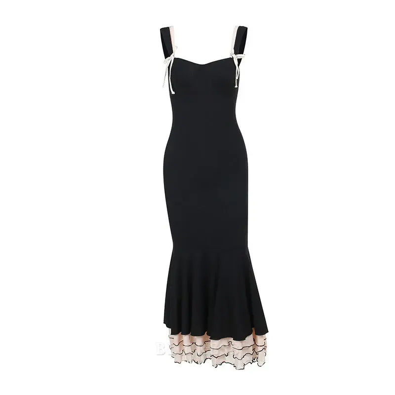 Close-up of the V-neck and bodice details of the black formal dress.