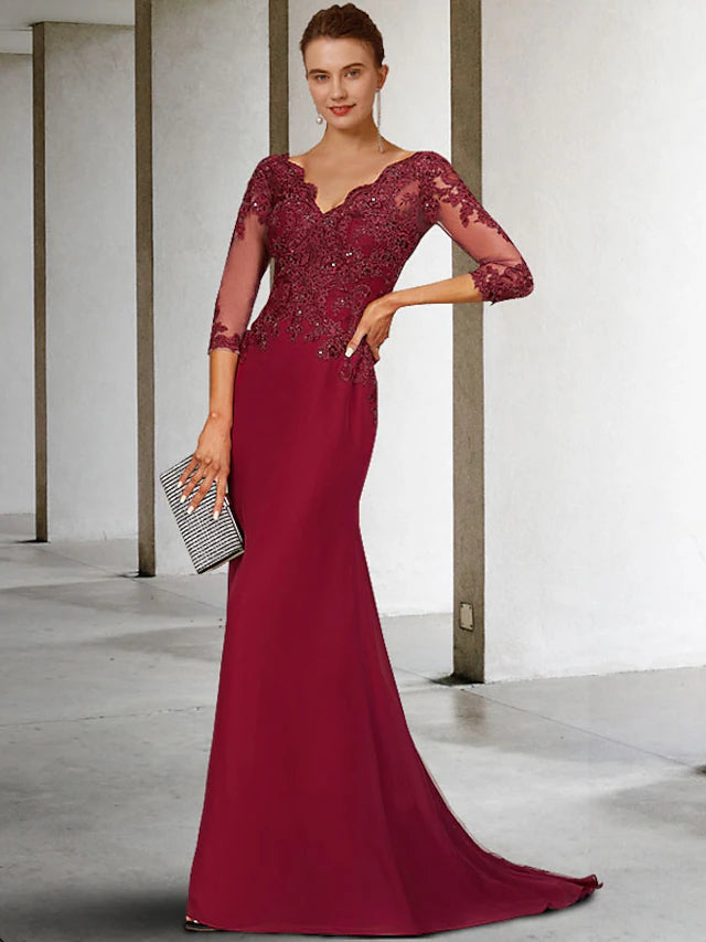 Elegant V-neck mermaid trumpet Mother of the Bride dress with 3/4 lace sleeves and sequin appliques.