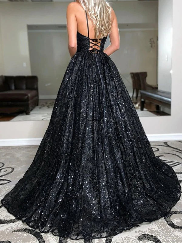 Back view of a black V-neck open back long prom dress.