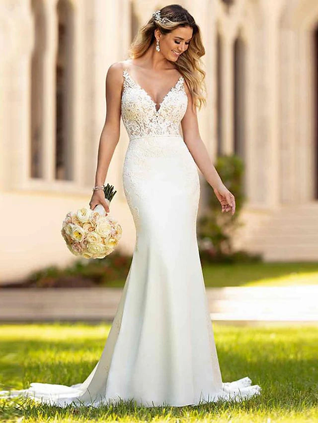 Elegant V-neck mermaid trumpet wedding dress with appliques and court train.