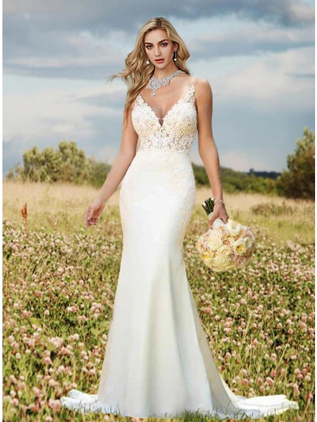 Side profile of the crepe wedding dress with a flattering silhouette.