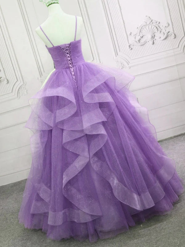 Full length view of a V-neck open back tulle A-line prom dress.