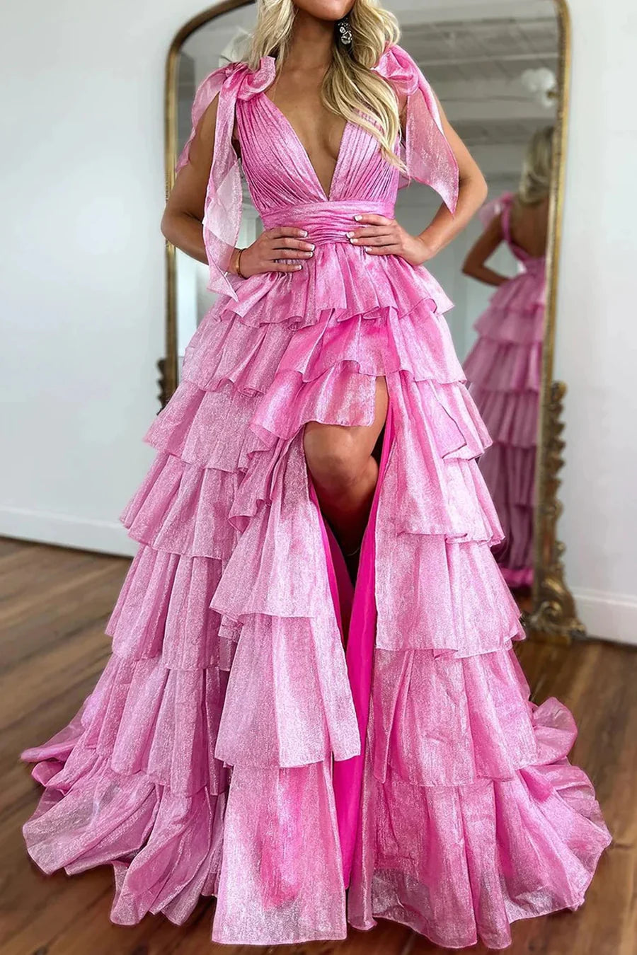Elegant V-neck organza ball gown on a model, showcasing the flowy maxi skirt.