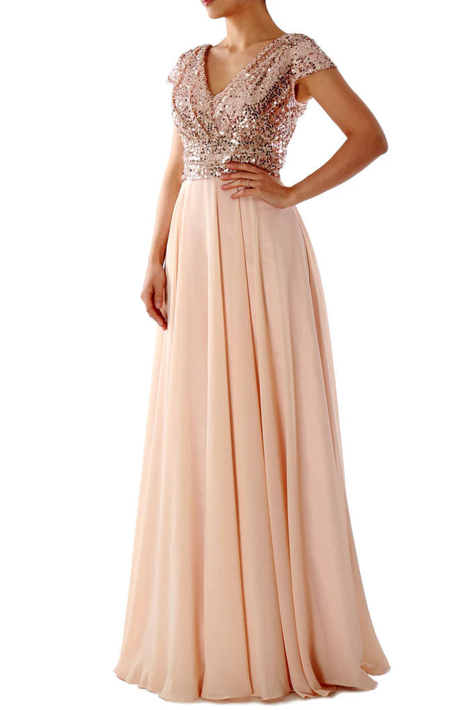 Back view of a woman showcasing the flowy chiffon skirt of the bridesmaid dress.