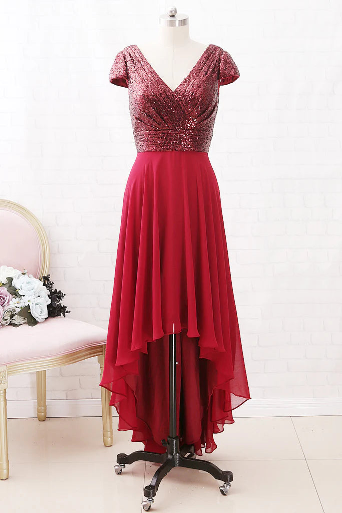 Woman wearing a sleeveless V-neck sequin chiffon high-low Mother of the Bride dress, front view.