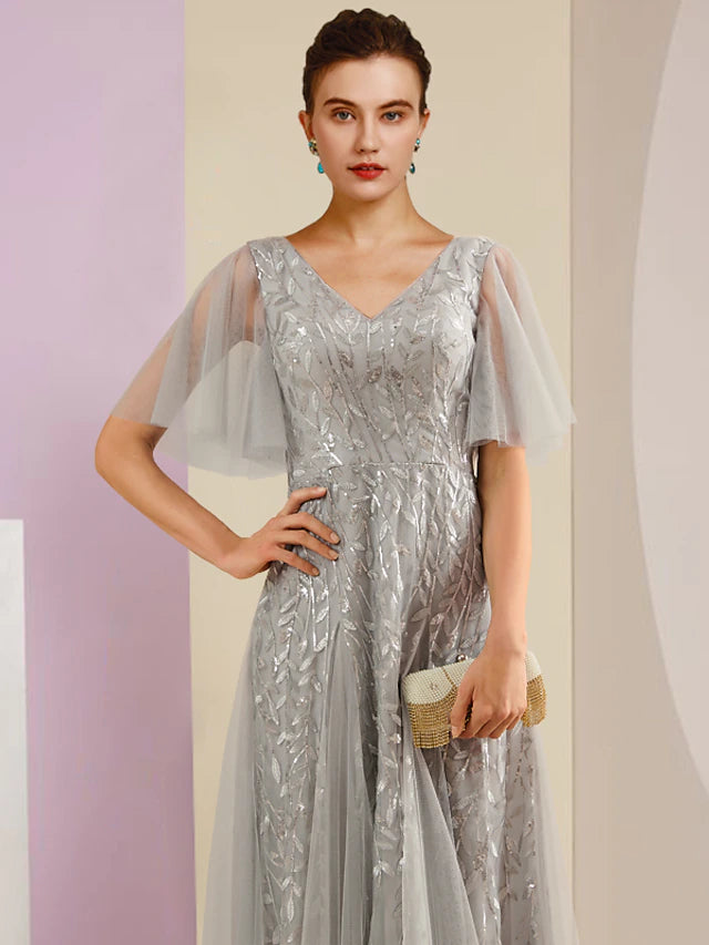 Close-up of the sequin and lace embellishments on the Mother of the Bride dress.