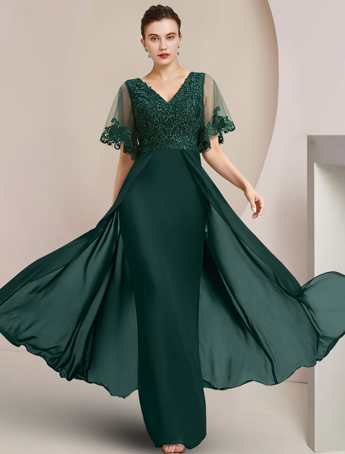 Elegant V-neck sheath gown with short sleeves, chiffon lace, and sequin appliques.