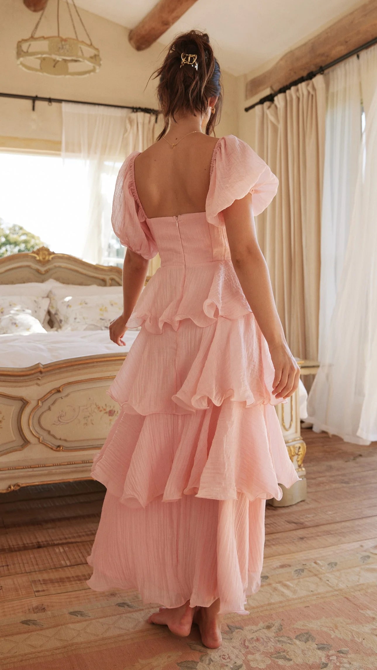 Close-up of the V-neckline and short sleeve detail on the dress.