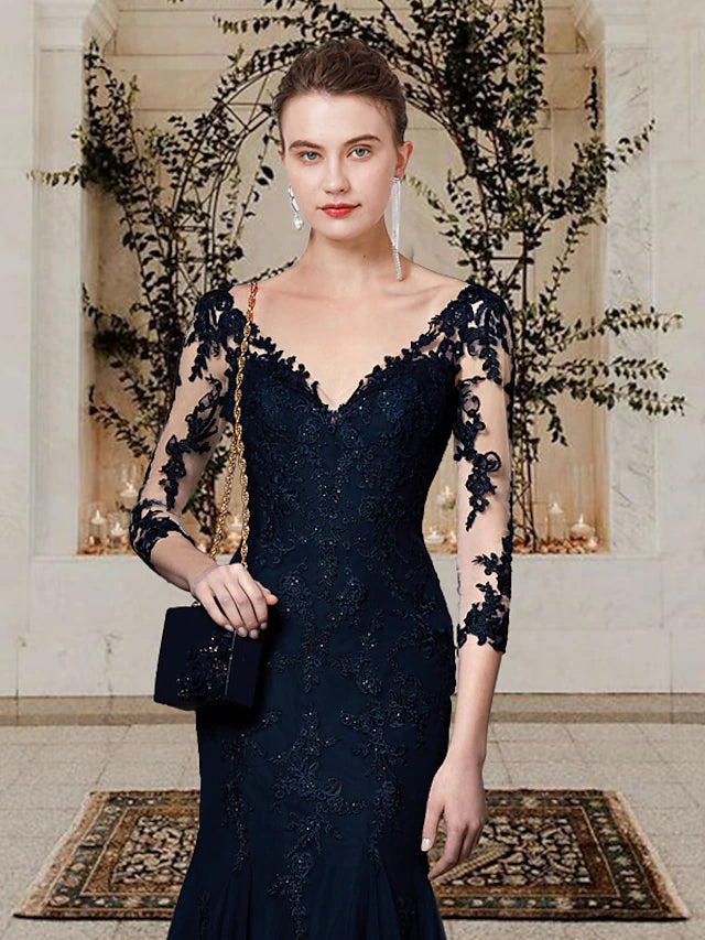 Mermaid trumpet mother of the bride dress with sweep train and intricate lace details.