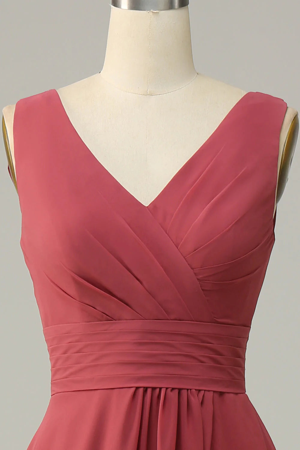 Side profile of a woman wearing a flowing chiffon bridesmaid dress.