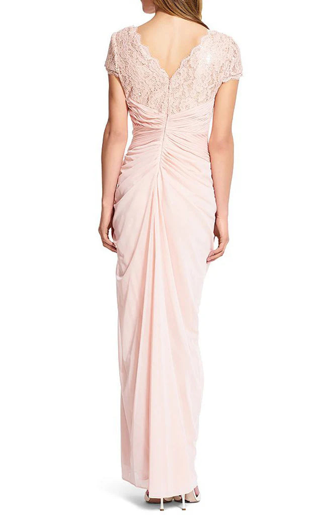 Close-up of the lace and chiffon details on a sleeveless formal dress.