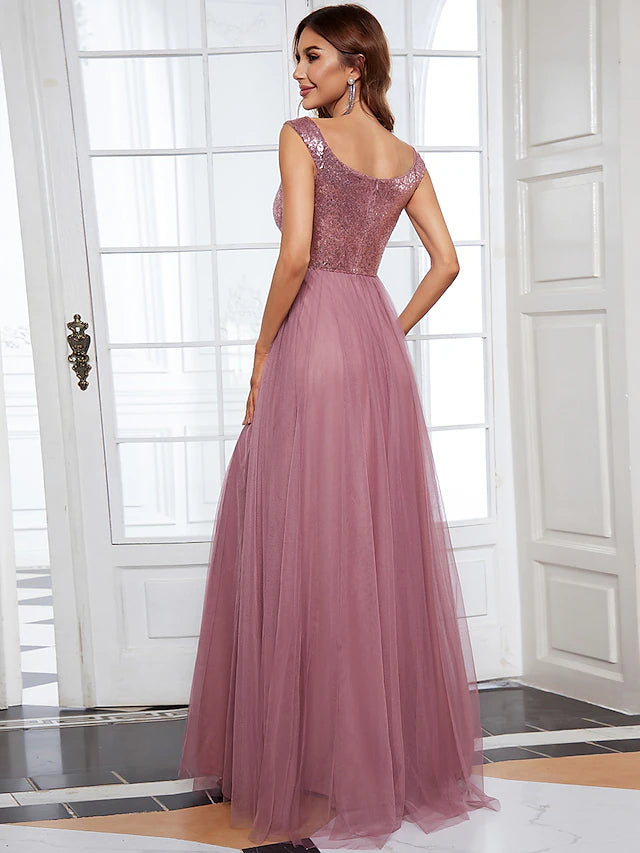Close-up of the V-neckline and sequined bodice of the bridesmaid dress.