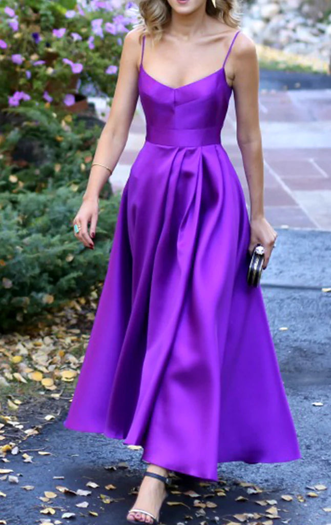 Model wearing an elegant V-neck spaghetti strap A-line satin tea length prom dress.