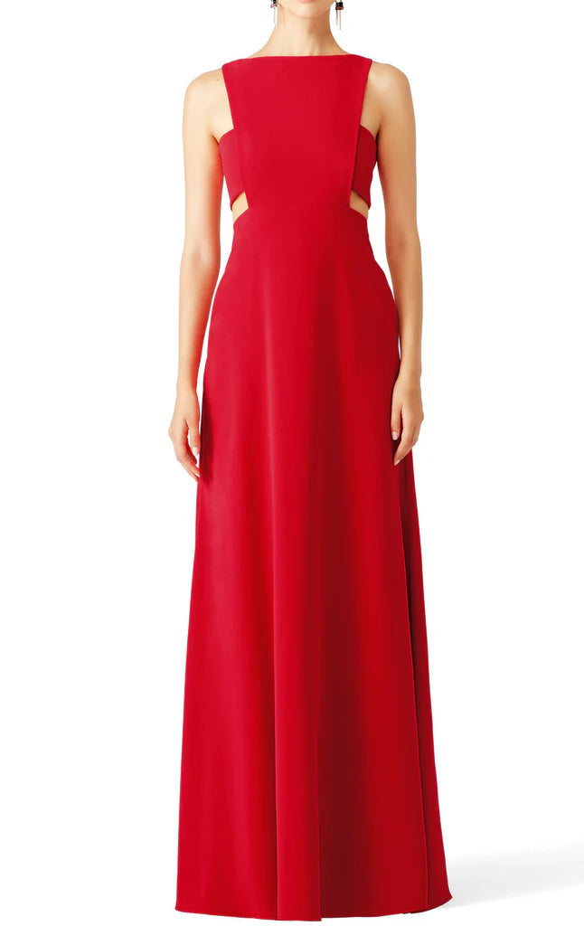 Woman wearing an elegant V-neck spaghetti strap formal maxi gown, front view.