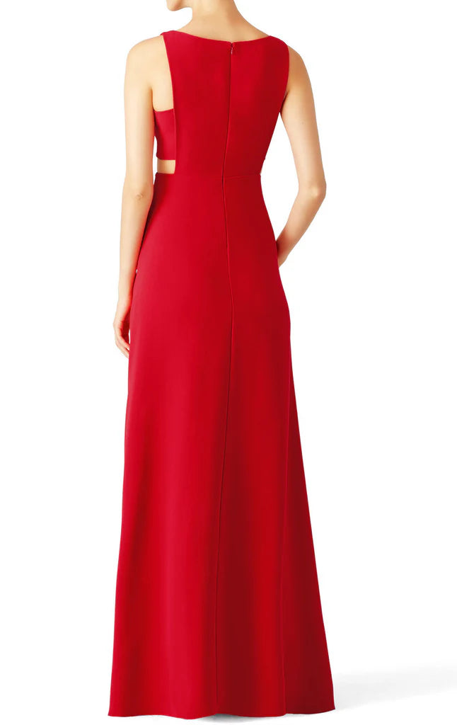 Woman wearing an elegant V-neck spaghetti strap formal maxi gown, side view.