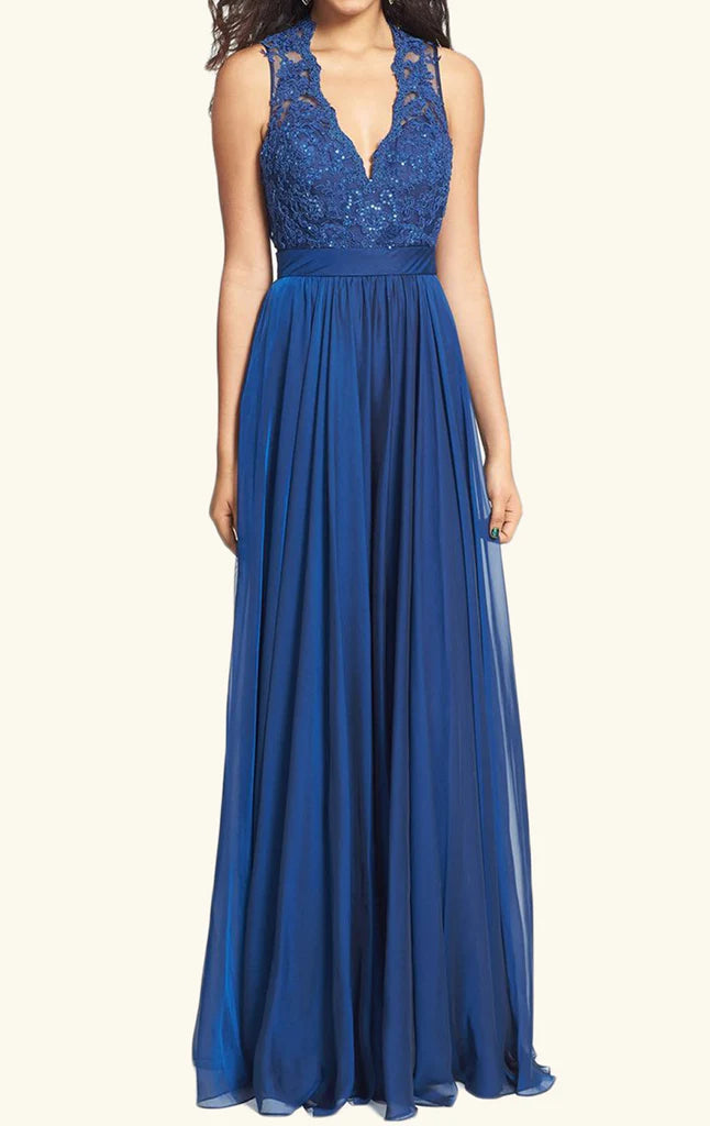 Woman wearing an elegant V-neck lace and chiffon long prom dress with spaghetti straps.