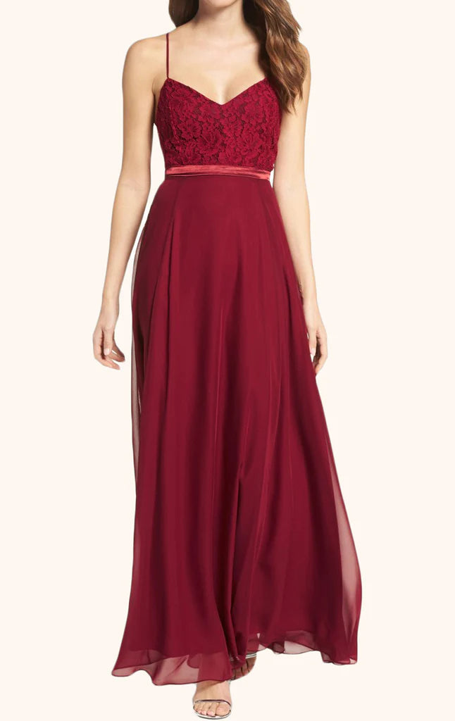 Woman wearing an elegant V-neck spaghetti strap lace and chiffon maxi prom gown.