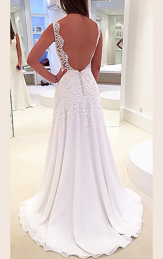 Full view of a flowing chiffon formal gown with lace bodice.
