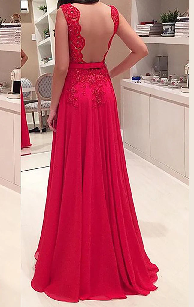 Back view of the long lace and chiffon formal gown, highlighting the elegant drape of the skirt.