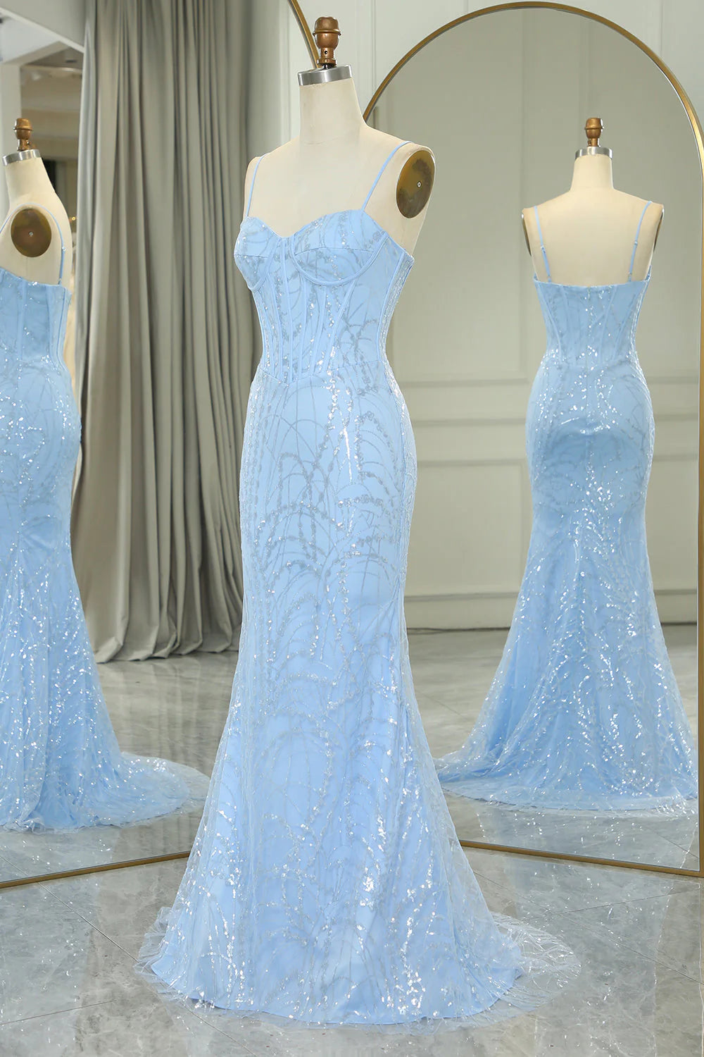 Back view of the light blue mermaid prom dress, featuring a flowing train and sequin details.